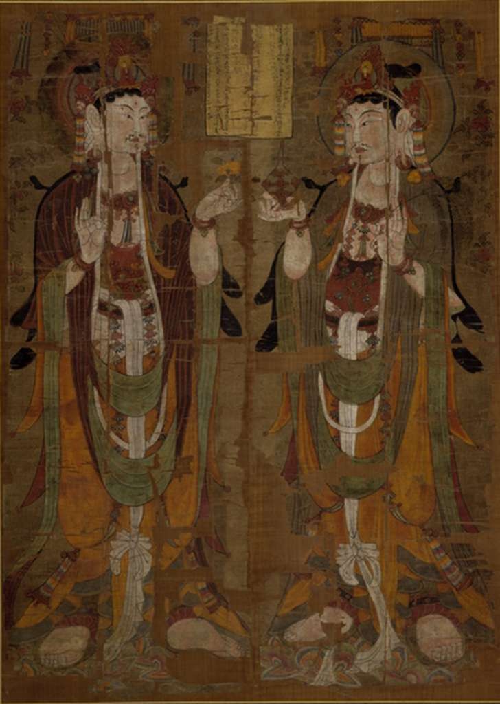 British Museum Top 20 17 Dunhuang Two Standing Avalokiteshvara 17. Two Standing Avalokiteshvara - , Cave 17 Dunhuang China, mid 9C AD, 147 x 105 cm. The British Museum has many artifacts that are not on display, like this one of almost 400 priceless Buddhist paintings on silk from the Dunhuang cave complex in China from the Stein collection. The painting shows two almost identical figures of Avalokiteshvara, one of the most popular of the bodhisattvas, identifiable by the small figure of the Buddha Amitabha in his headdress. One of the only differences between the two figures are the attributes that they hold: that on the left holds a flower, that on the right a vase and a willow branch. All three were popular attributes of Avalokiteshvara. The inscription in the centre of the painting translates in part: 'the disciple of pure faith, Yiwen, on his own behalf, having fallen [into the hands of the Tibetans], hopes that he return to his birthplace.' Therefore this example was commissioned to ensure a peaceful life during the period of war with the Tibetans, who finally had to give up Dunhuang in 948 AD. For more information on Dunhuang, check out <a class='a' href='http://idp.bl.uk/idp.a4d'>The International Dunhuang Project</a>.